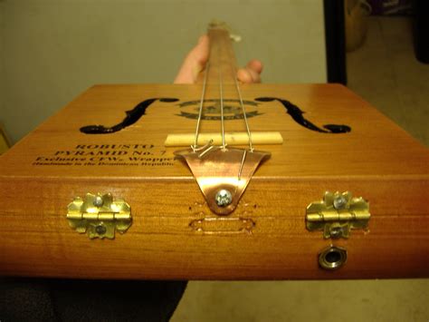 homemade electric cigar box guitar|bujilding a cigar box guitar.